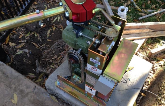 A gate motor being serviced