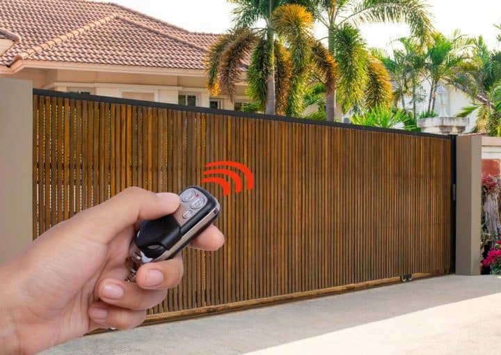 Person operating a gate remote control