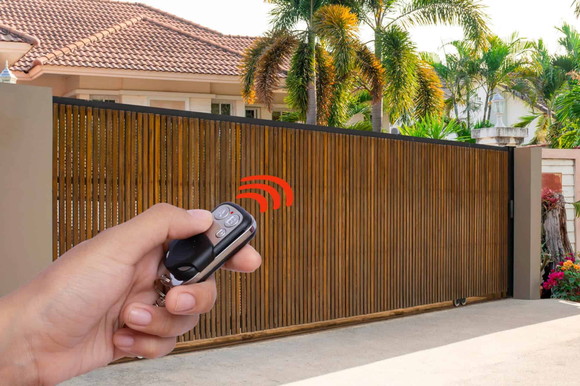 Person operating a gate remote control