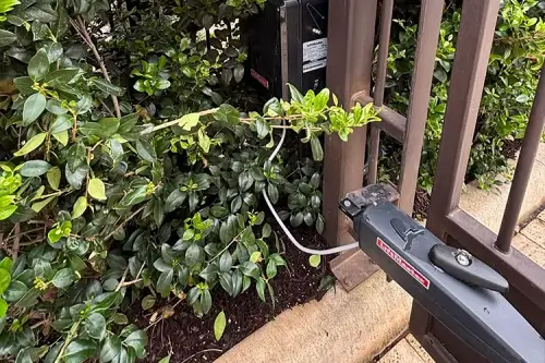 Close up of hinges on an automatic swing gate